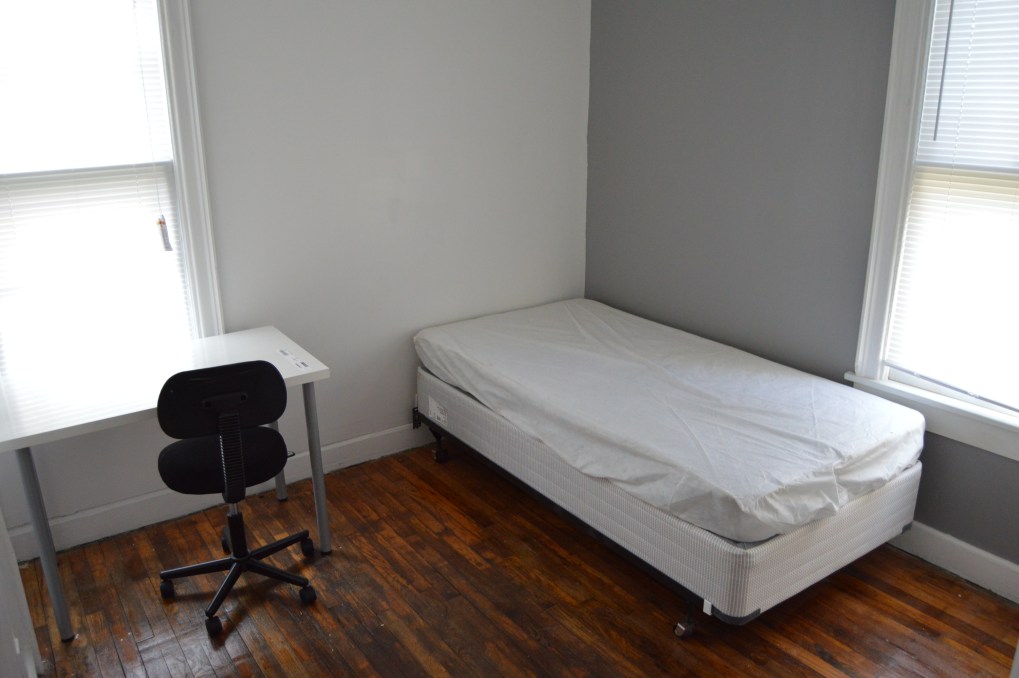 bedroom with twin bed and desk and chair