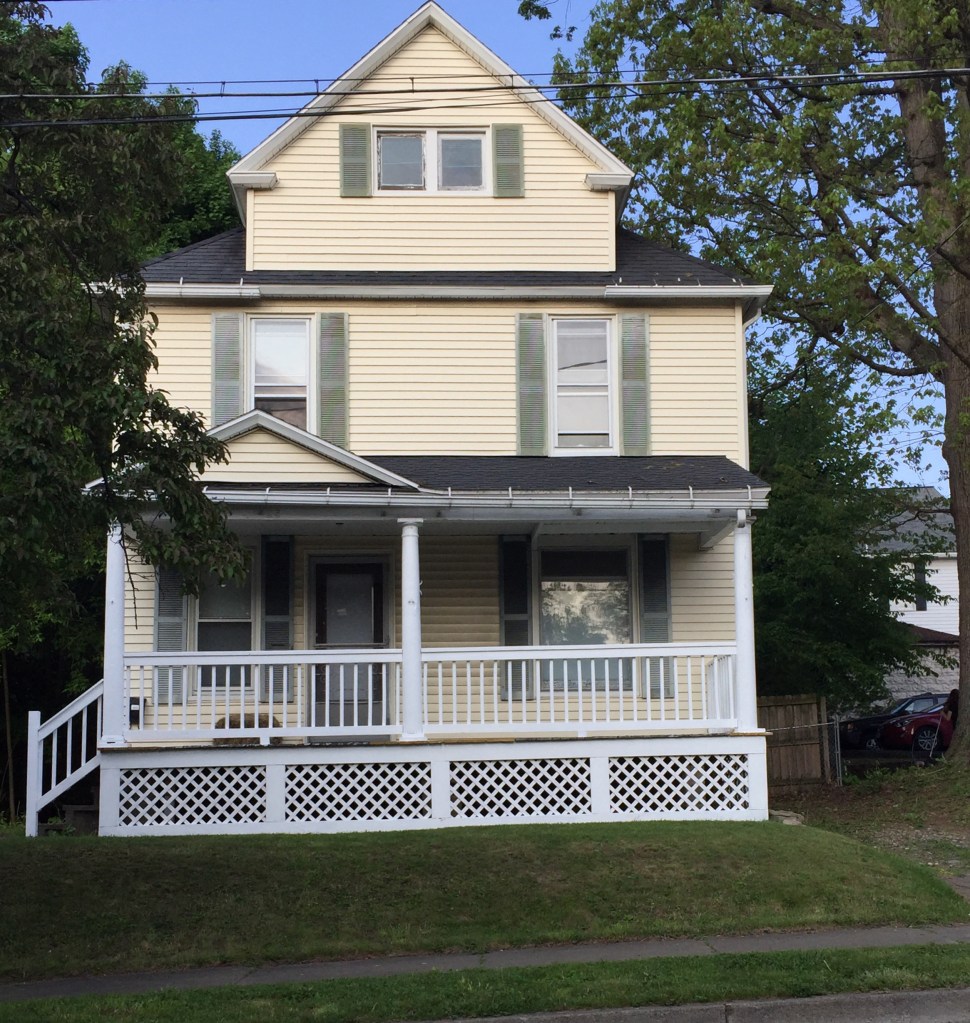 yellow house with white porch