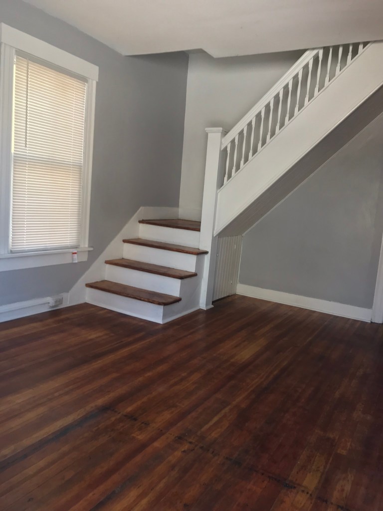 open living area with stairs that go up