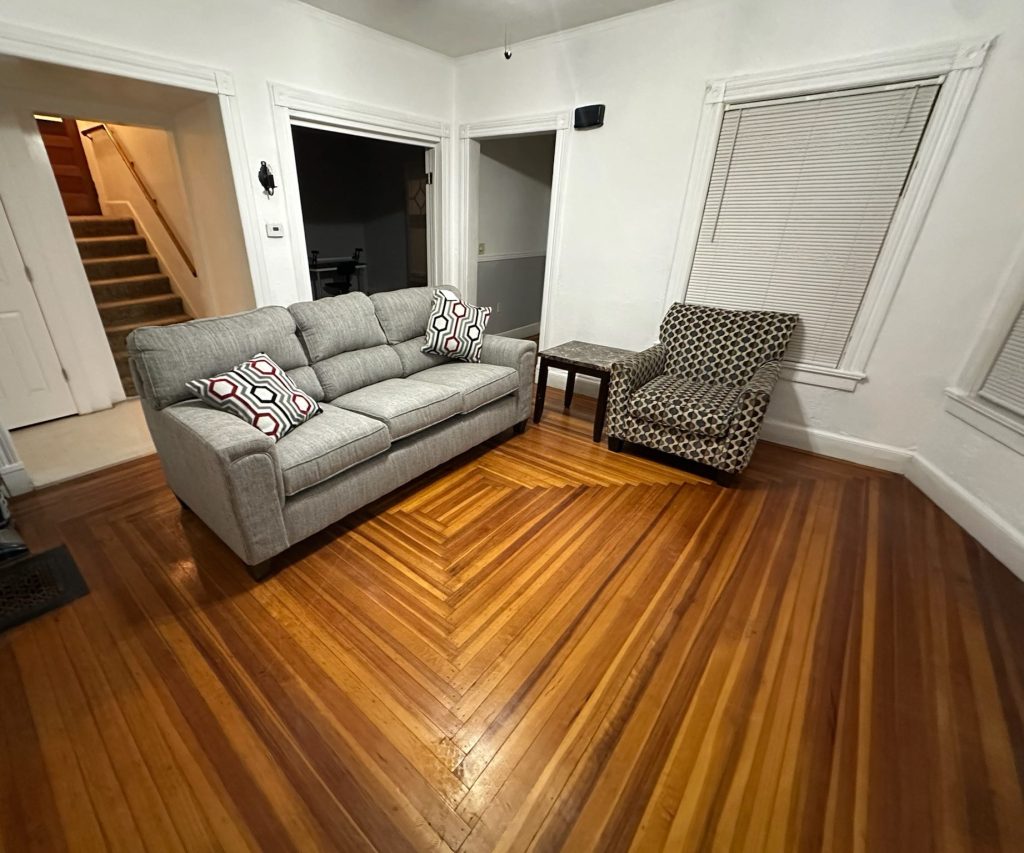 Living room with couch, chair and end table.
